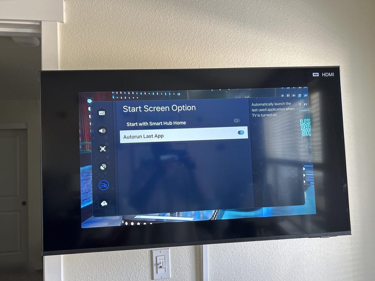 TV mounting or home theater setup detail with display placement, mount work, cabling or finished installation context