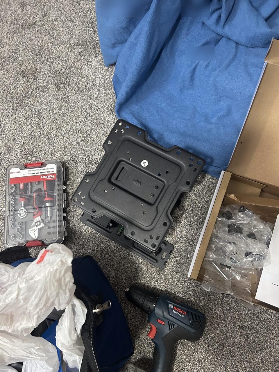 Display bracket or mounting preparation onsite near the mounting location during an Alrty onsite service visit