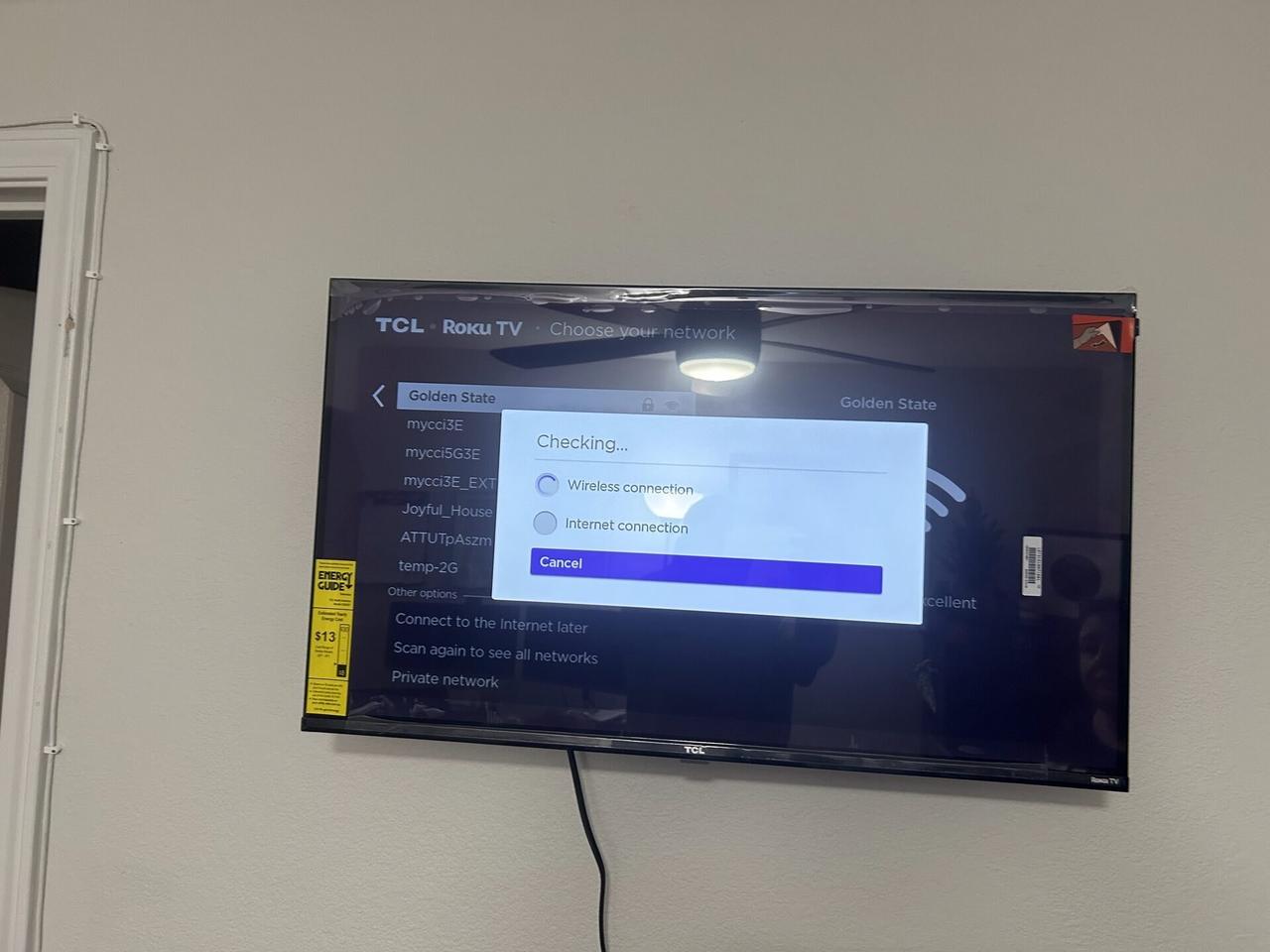 TV mounting or home theater setup detail with display placement, mount work, cabling or finished installation context