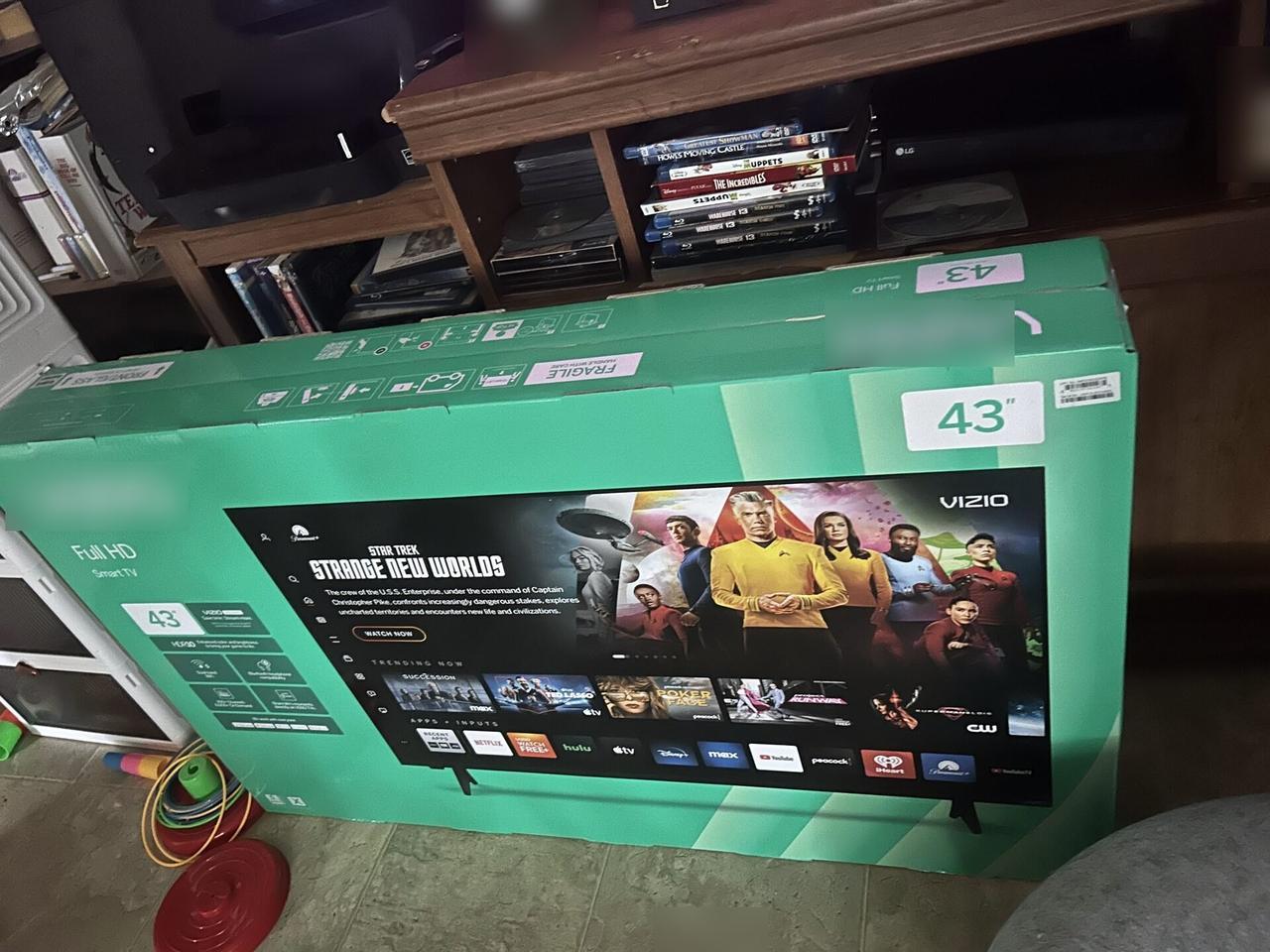 TV mounting or home theater setup detail with display placement, mount work, cabling or finished installation context