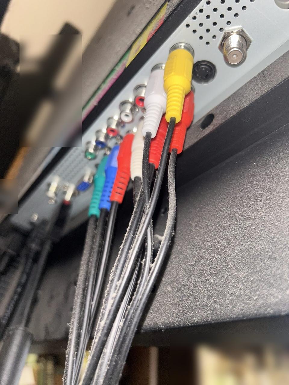 TV mounting or home theater setup detail with display placement, mount work, cabling or finished installation context
