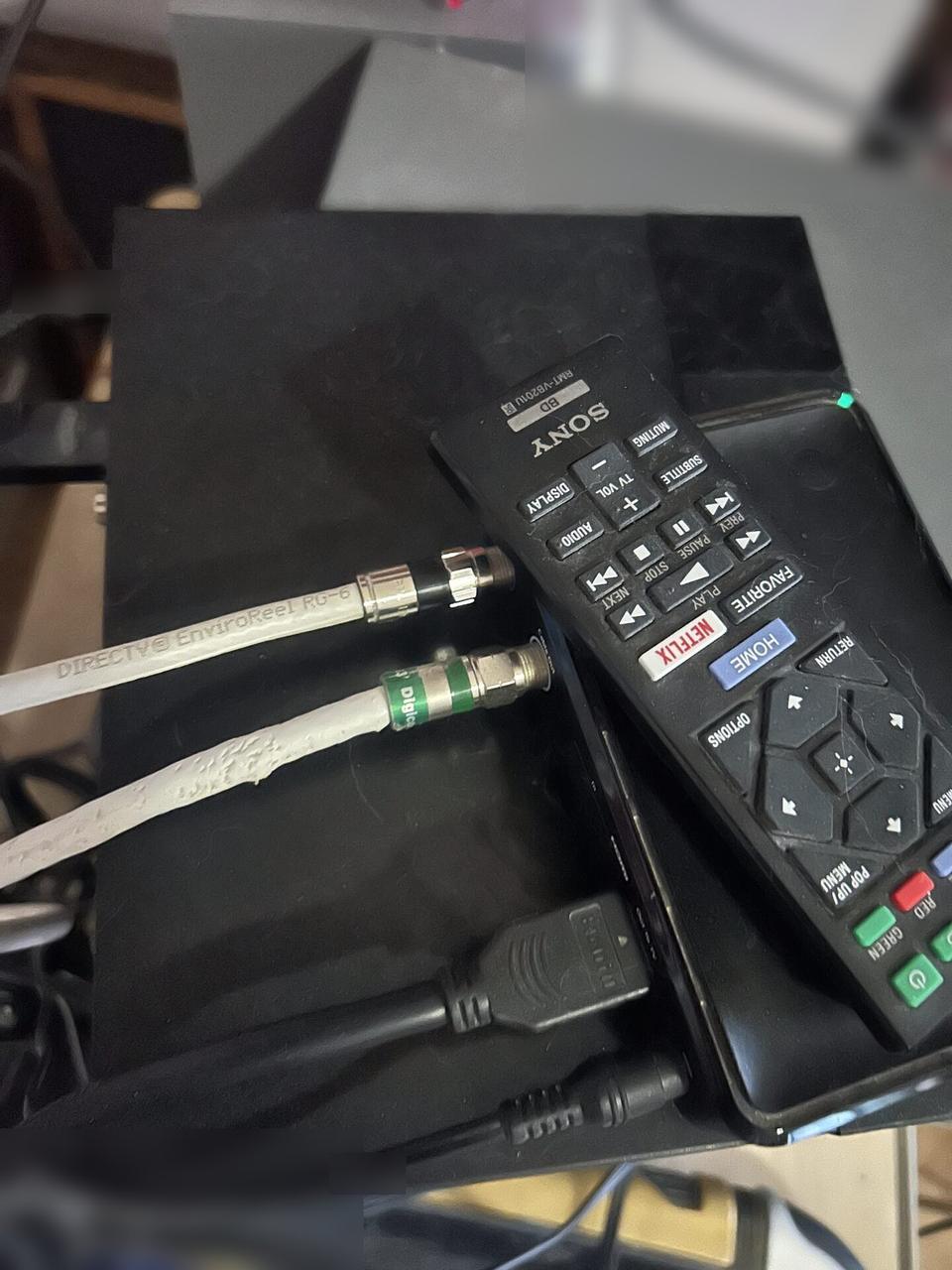 TV mounting or home theater setup detail with display placement, mount work, cabling or finished installation context