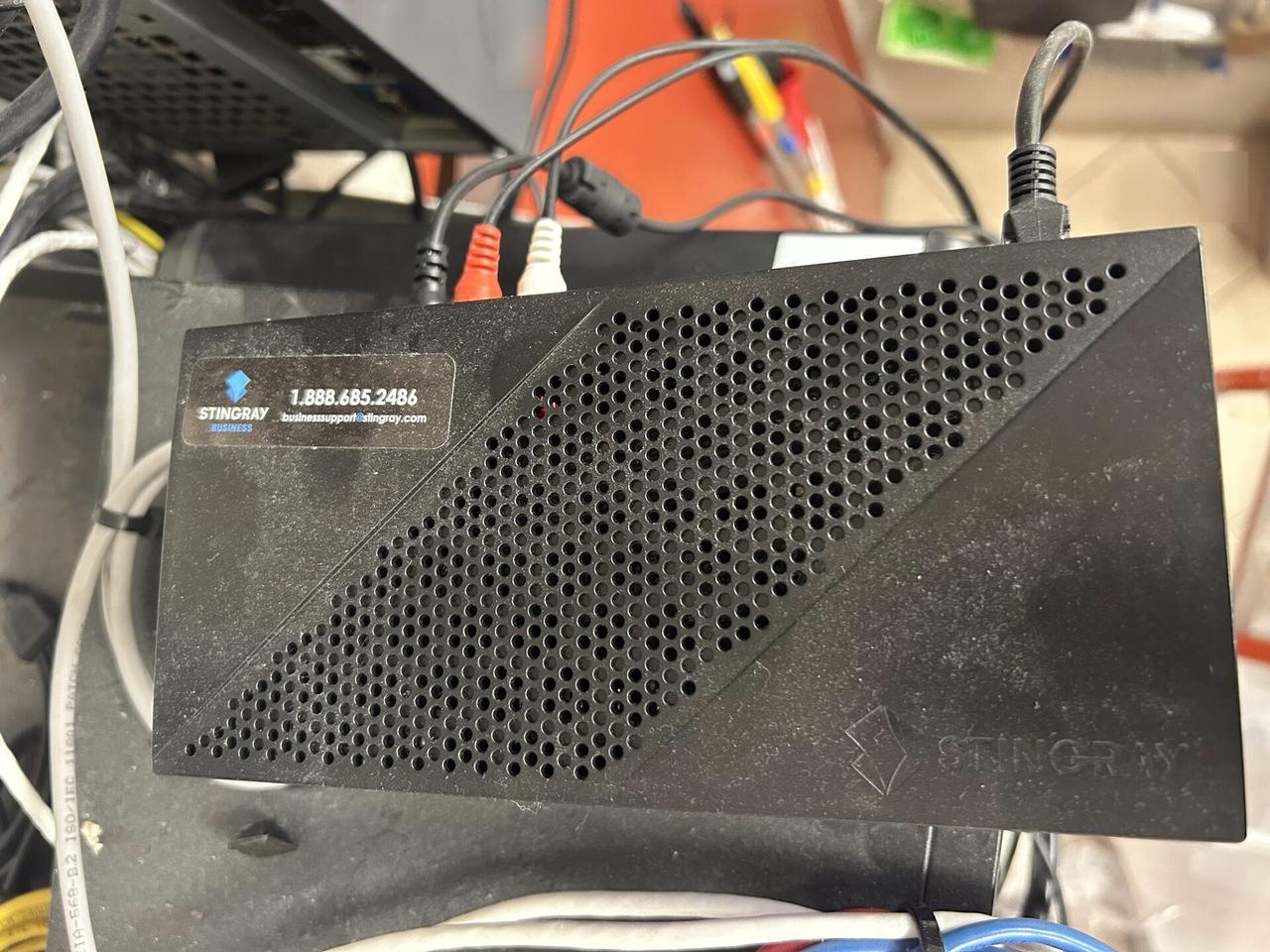 Onsite service photo showing low-voltage hardware and device cabling at the device handoff point