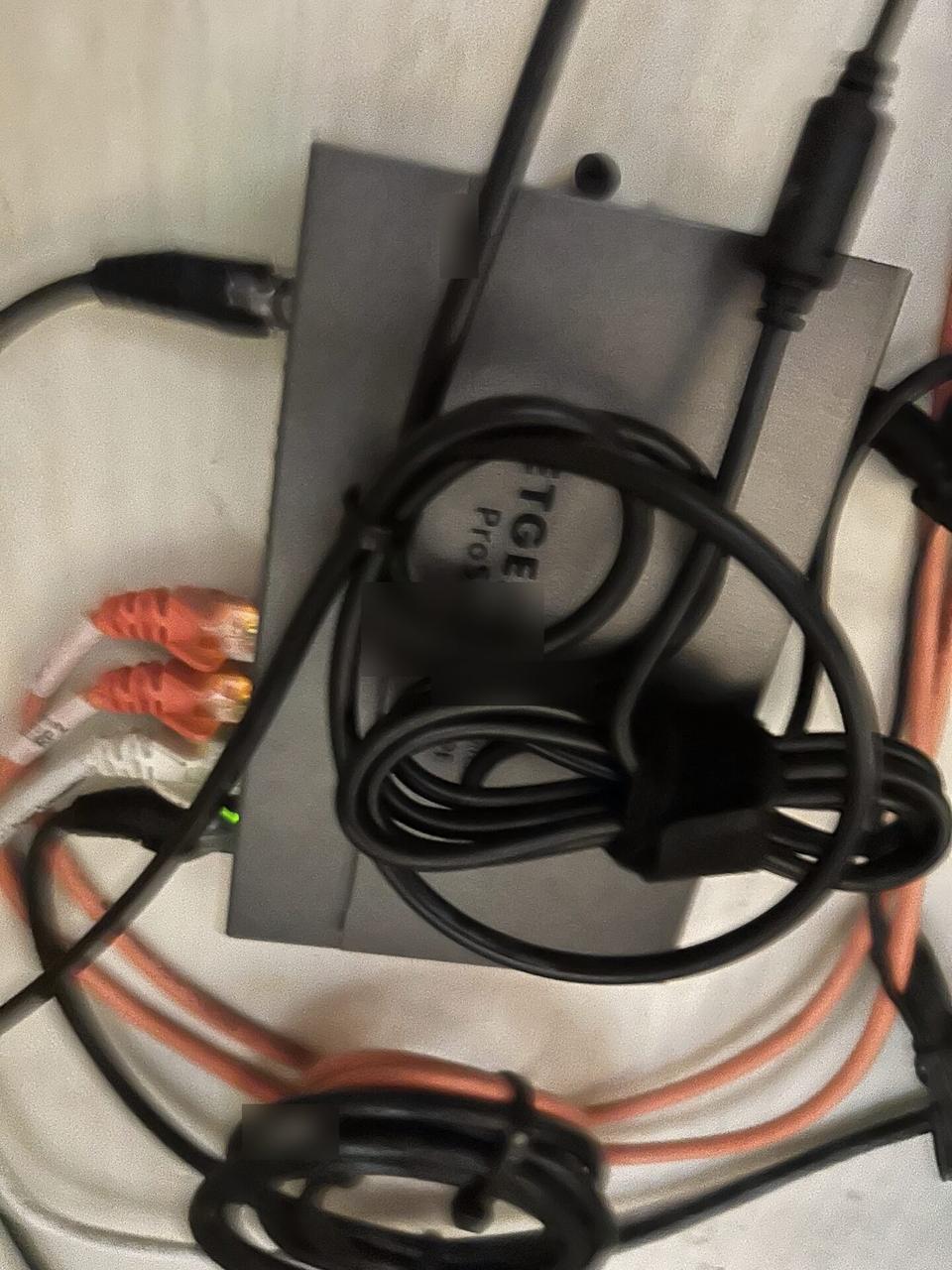 Service documentation showing low-voltage hardware and device cabling before trim-out or final setup