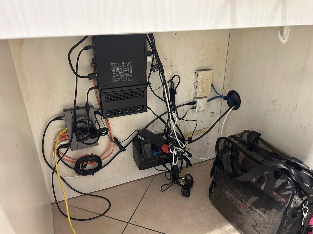 Alrty portfolio view of checkout station cabling and retail device setup at a checkout lane