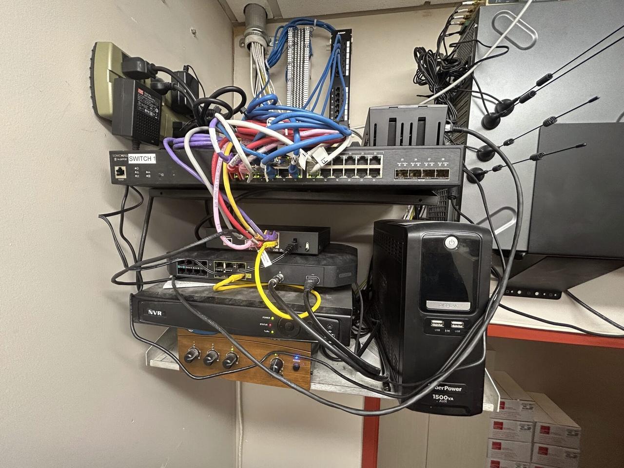 Alrty portfolio view of server-room cabinet and structured network equipment at the server-room handoff point