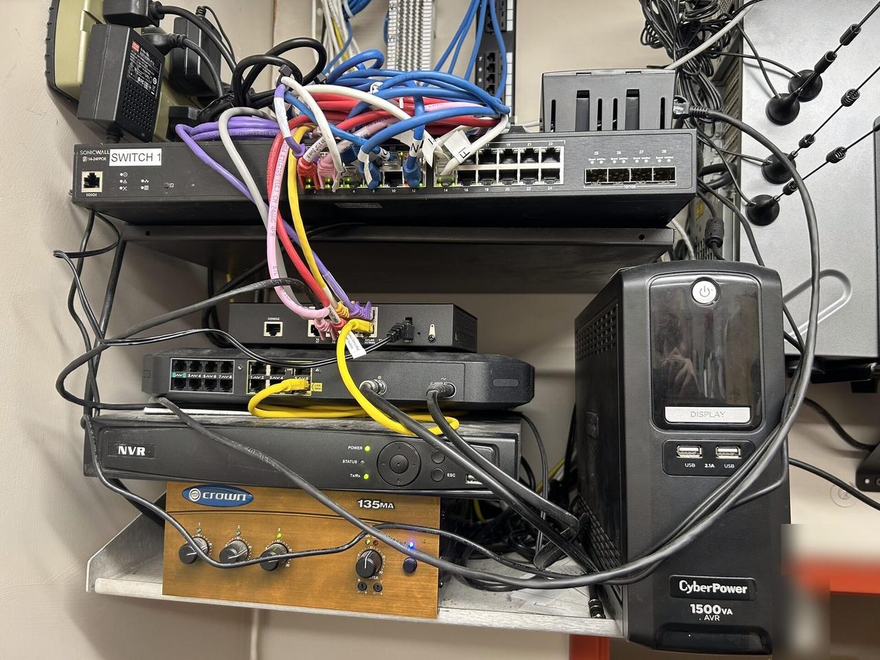 Alrty field photo with network rack and patch panel cabling inside the equipment cabinet