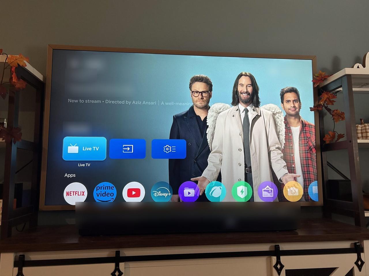 TV mounting or home theater setup detail with display placement, mount work, cabling or finished installation context