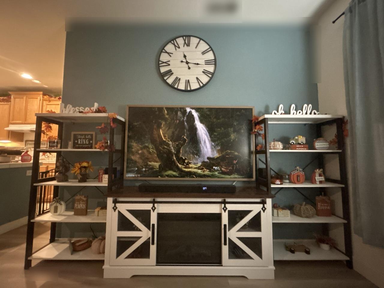 TV mounting or home theater setup detail with display placement, mount work, cabling or finished installation context