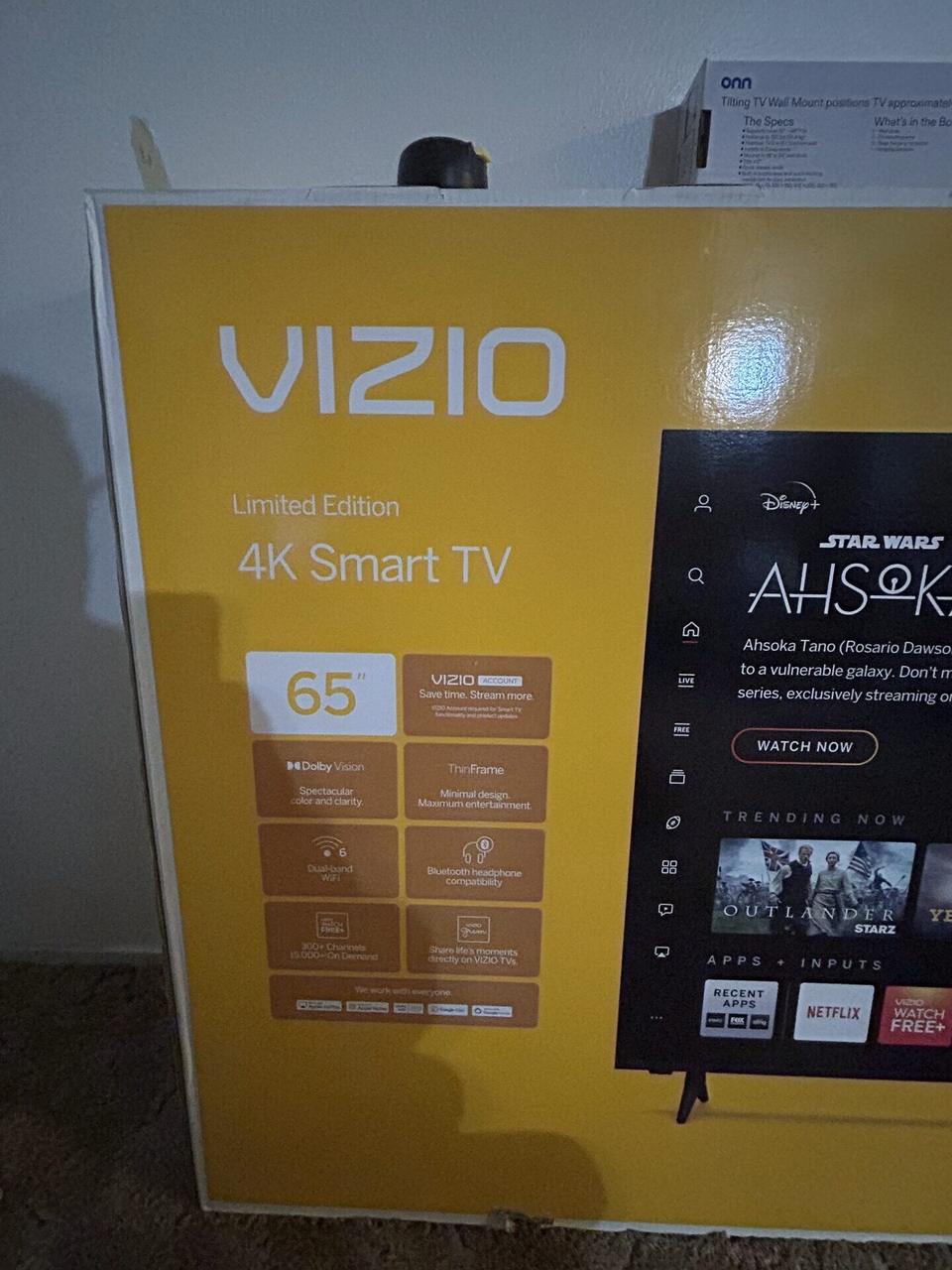 TV mounting or home theater setup detail with display placement, mount work, cabling or finished installation context