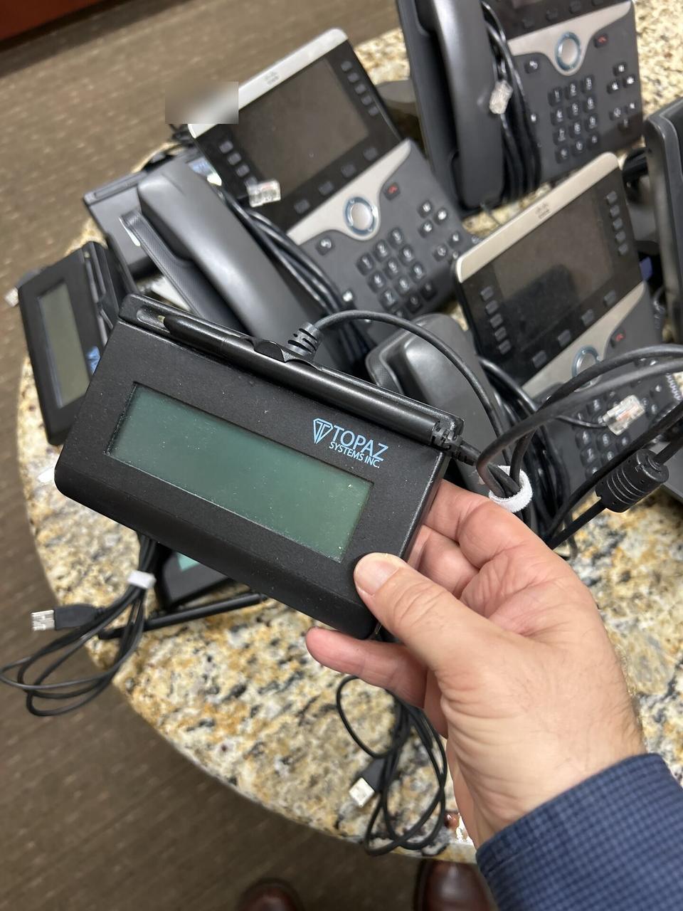 Onsite service photo showing VIP phone setup in a public-safe service photo during telephony troubleshooting