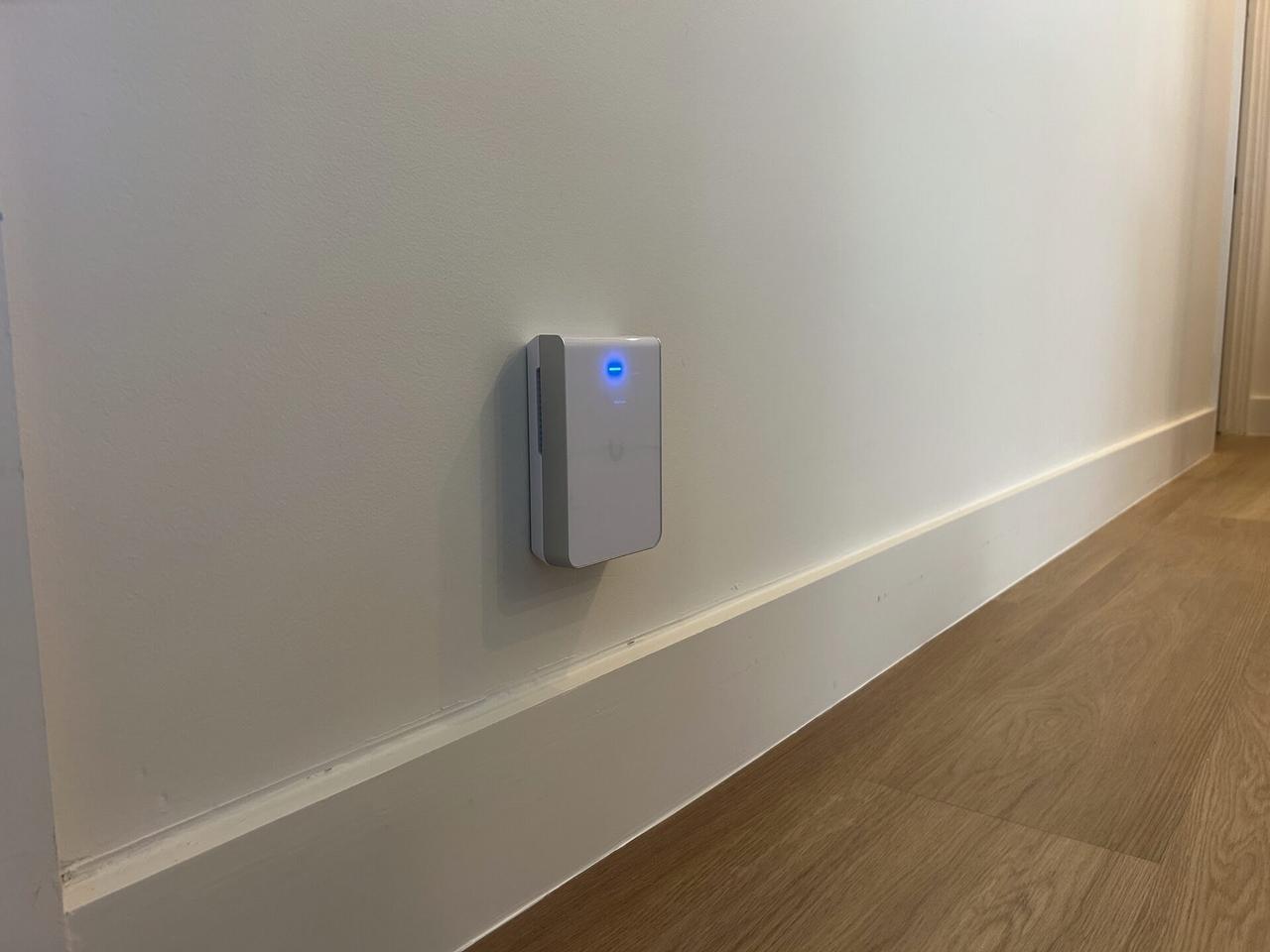Wall-mounted home access point during an Alrty onsite service visit