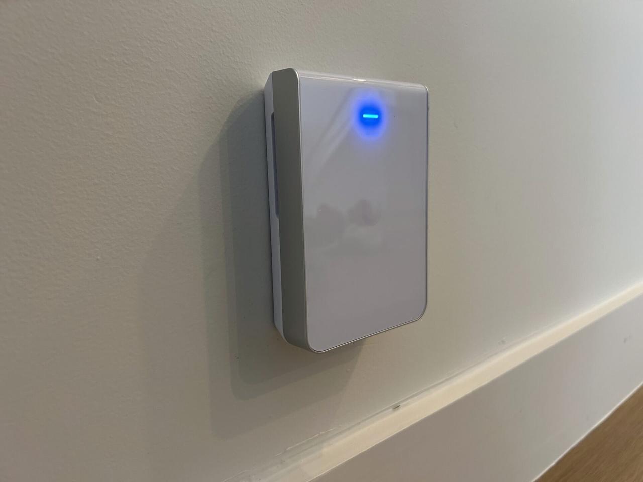 Public-safe portfolio image of wall-mounted home access point