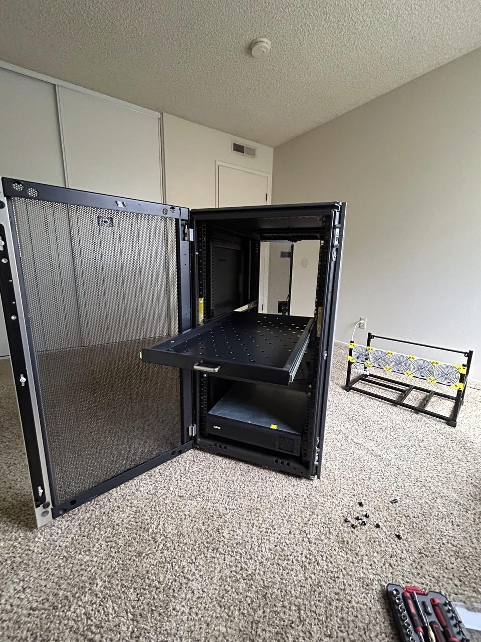 Server-room cabinet and structured network equipment during switch or patch-panel service documented for a smart technology service call