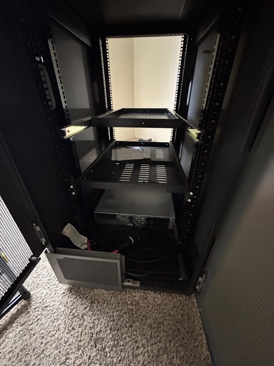 Public-safe portfolio image of network rack and patch panel cabling at the server-room handoff point