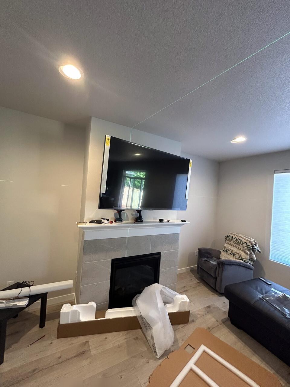 Display bracket or mounting preparation onsite during TV service preparation documented for a smart technology service call