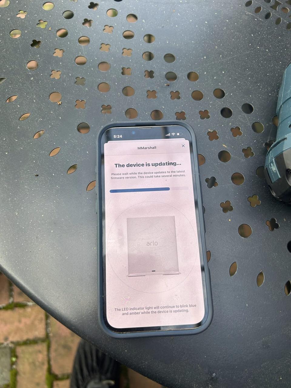 Service documentation showing smart security device wiring during onsite work with private views omitted
