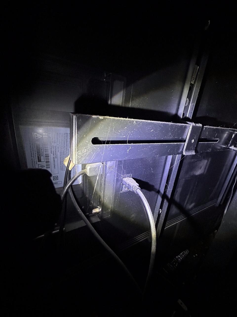 Alrty portfolio view of wall-mounted TV setup and cable routing with cable routing visible
