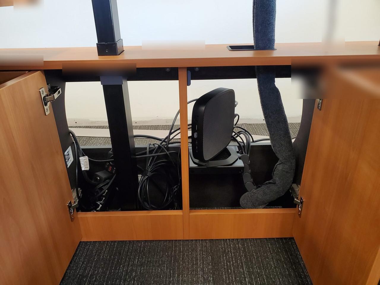 Smart technology service detail: computer station setup with connected peripherals before final user handoff