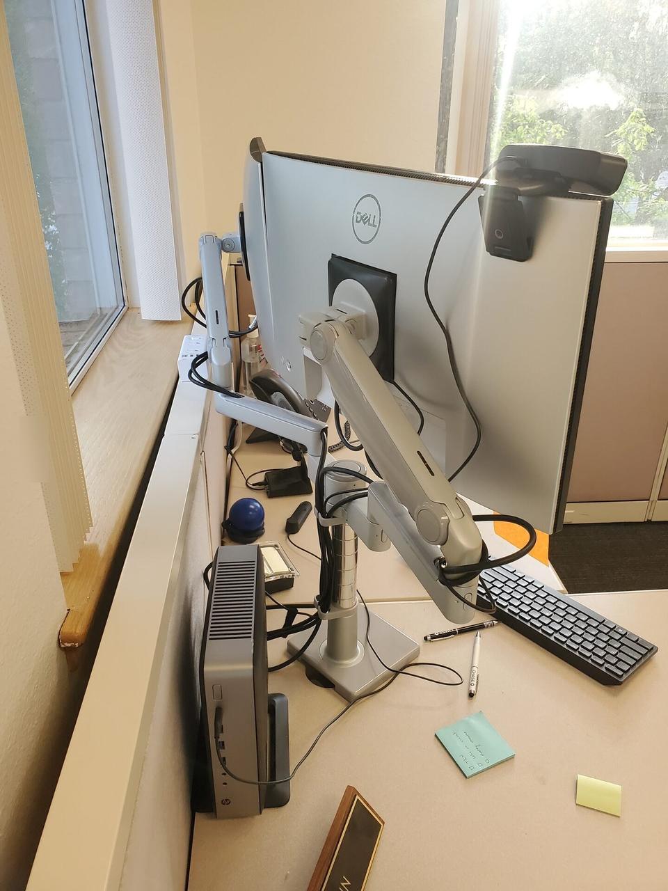 Smart technology service detail: desk-side workstation setup during onsite service before final user handoff