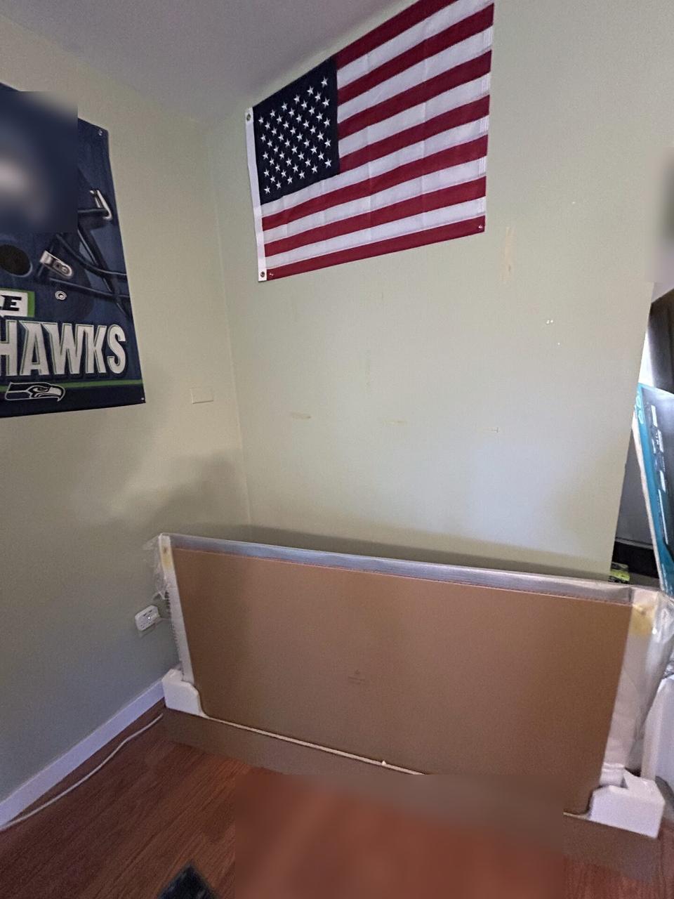 TV mounting or home theater setup detail with display placement, mount work, cabling or finished installation context