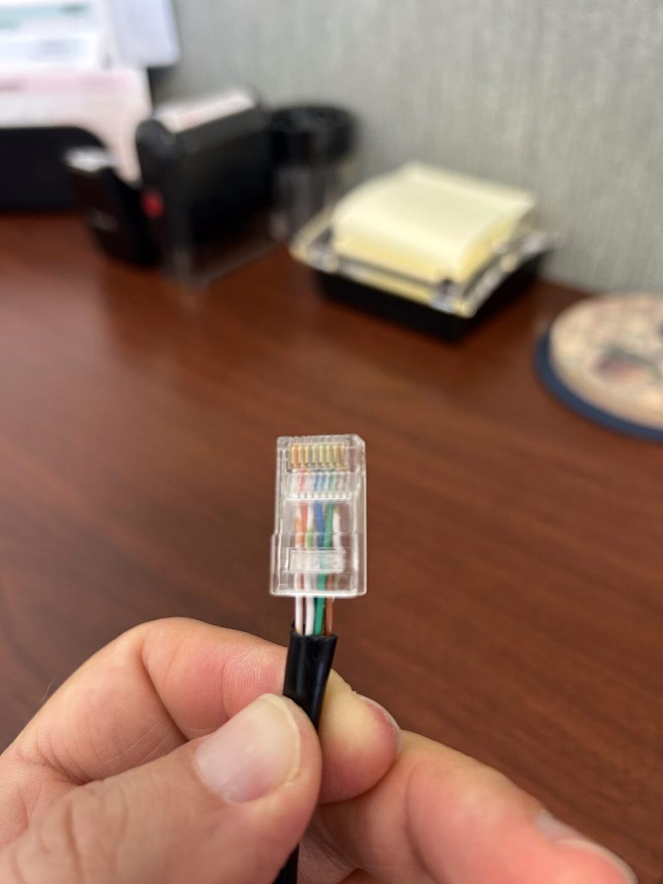Smart technology service detail: low-voltage cable routing and device handoff during field wiring work